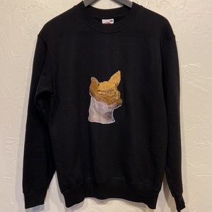A cotton sweater with sequined dog embellishment. Black S